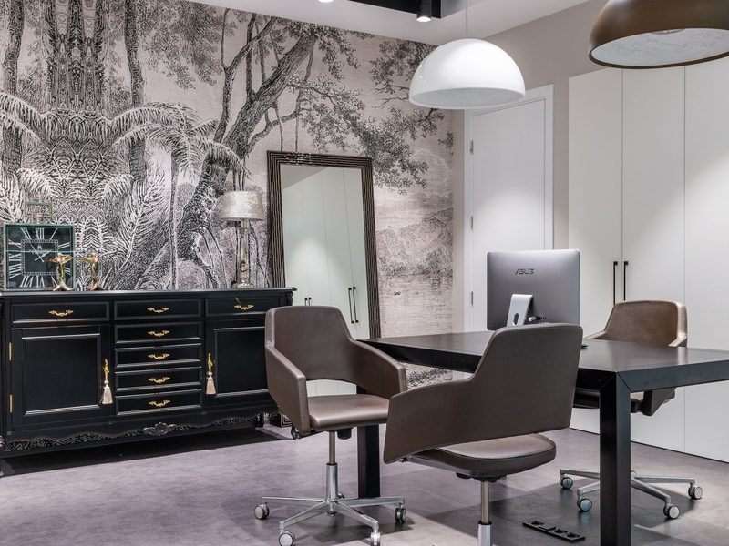 Living room with detailed monochrome scenic patterned wallpaper